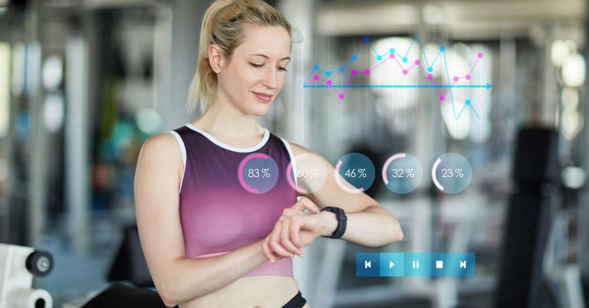 Woman stands in workout apparel checking her AI-powered smartwatch to monitor her vitals.